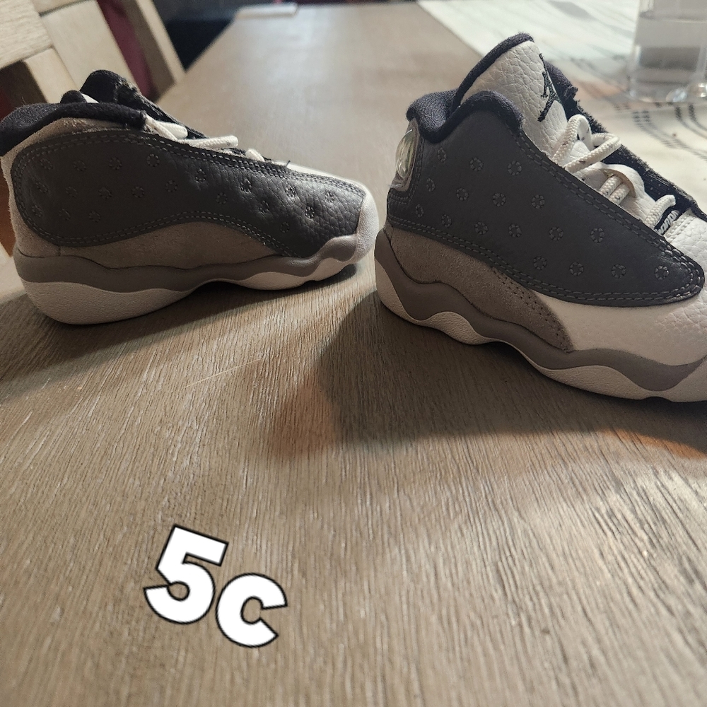 Grey and white jordans